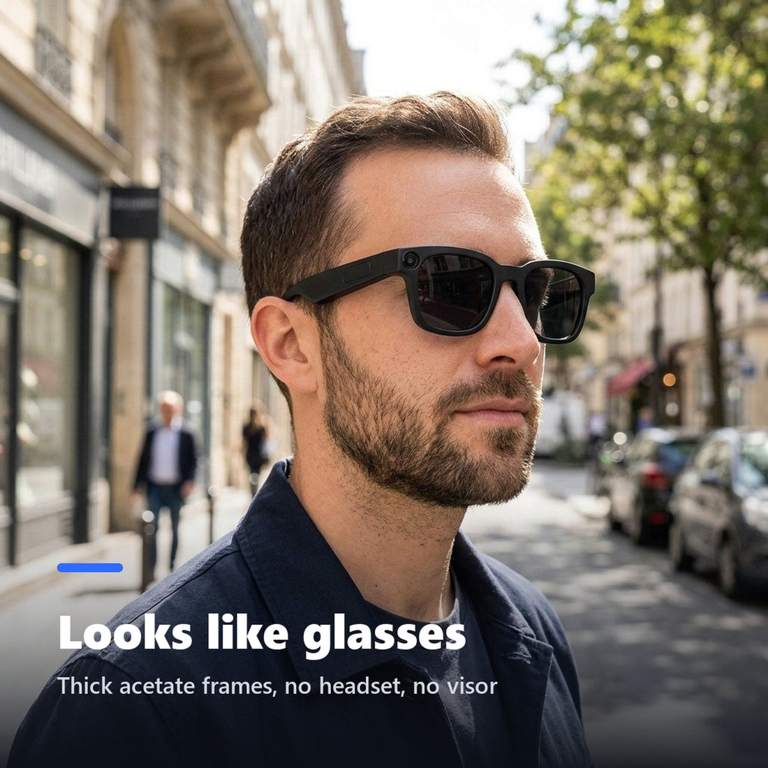 Man wearing black camera smart glasses with tinted lenses outdoors