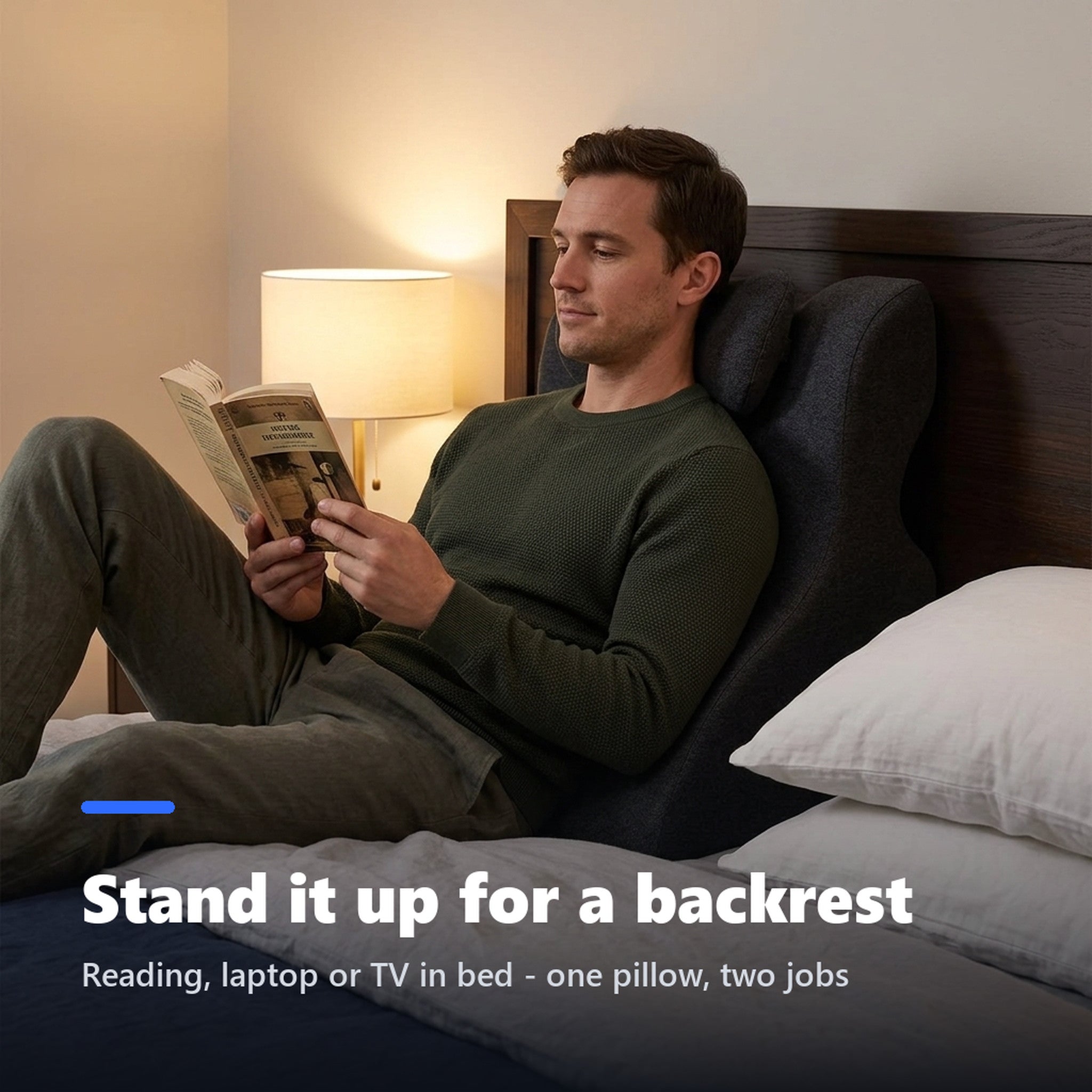 Man reading in bed leaning on the prone pillow stood upright as a backrest