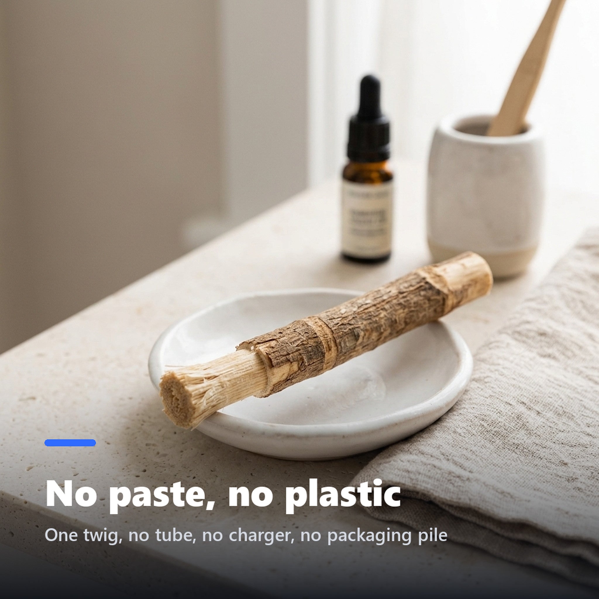 Miswak stick resting in a ceramic dish on a bathroom counter