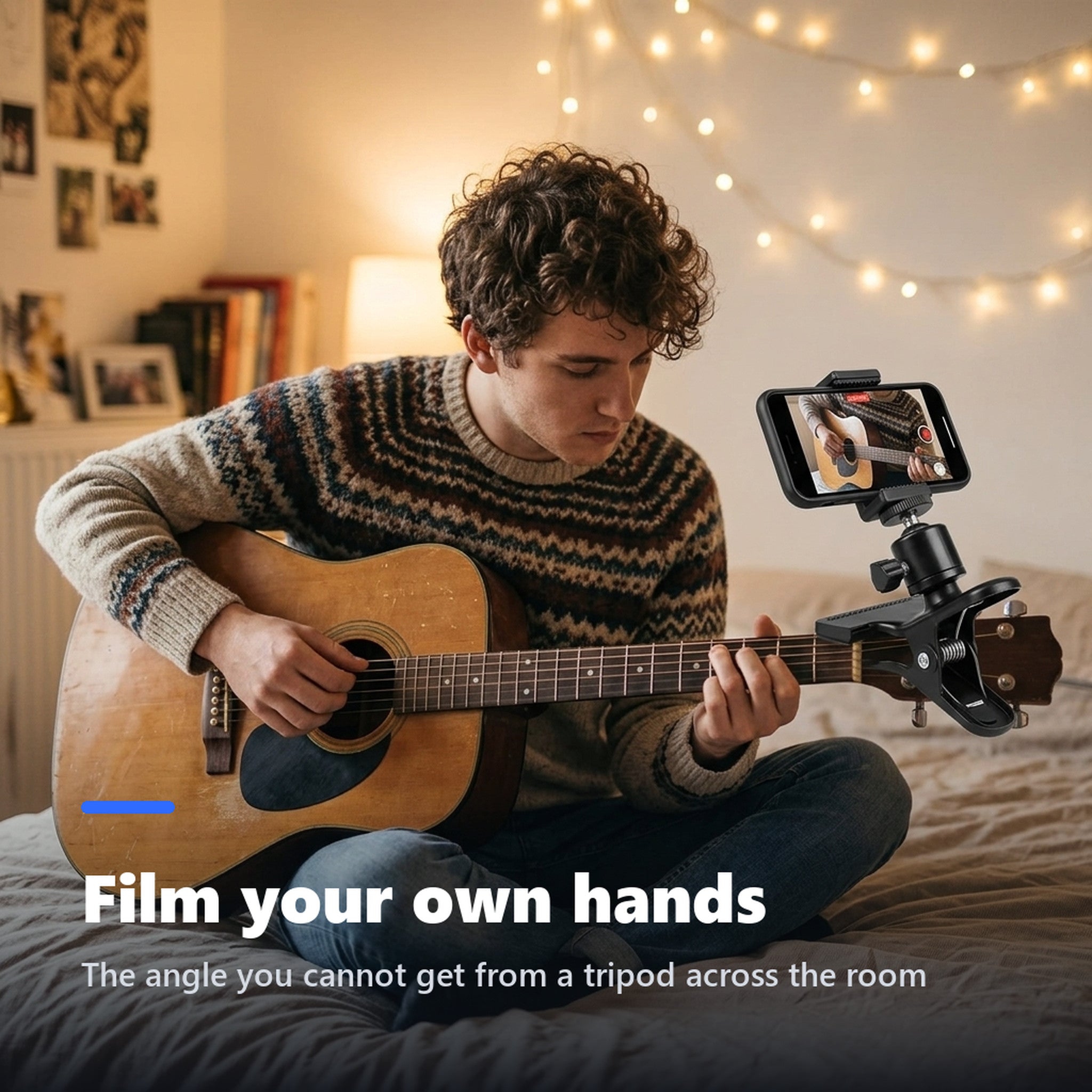 Guitarist filming his hands with a phone mounted on the headstock