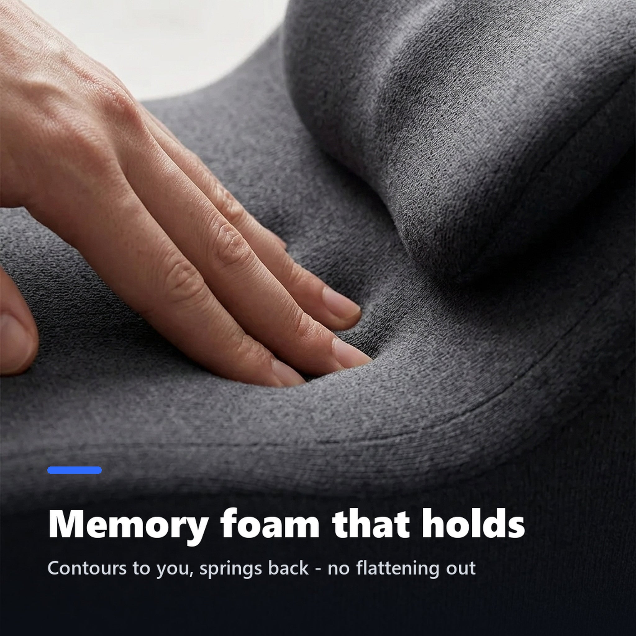Hand pressing into the memory foam surface of the prone pillow